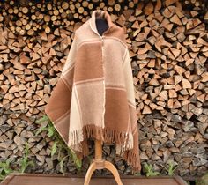 "The thick beige brown scarf is sewn from lamb's wool knit, wide and warm. Dimensions without fringes: 180 x 80 cm/ ~70 x 31 inches/, approximate weight: 870 g /1.92Lb/. Care tips for wool products. It is best to dry clean wool products (symbol \"P\") or wash by hand in lukewarm water(under 30 oC or 86 oF) with a liquid detergent. Machine wash in wool or delicate mode using a low speed spin or without using a centrifuge( also below 30 oC or 86 oF), allowing excess water to drain freely by curling the blanket over a thick cord or rod. Do not expose to heat or sunlight. Ironing. Adjust the iron to a two-point mark (Wool), iron from the left, preferably through a moistened white cotton cloth. You can also steam iron with just a light touch of the material." Cozy Brown Shawl For Fall, Brown Alpaca Shawl For Fall, Beige Wool Shawl For Winter, Brown Wool Shawl Scarf, Beige Wool Winter Shawl, Winter Beige Wool Shawl, Brown Alpaca Shawl, Brown Wool Shawl For Fall, Brown Wool Shawl