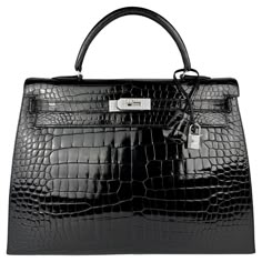 Up for sale is the Holy Grail Hermès Kelly 35 Diamond Black Shiny Crocodile. The Diamond Kelly is the pinnacle of luxury and elegance, celebrated as one of the rarest and most exquisite handbags in the world. Crafted from Porosus crocodile leather, the bag features a pearly black shine, that elevates this Diamond Kelly to a level of pure opulence is the dazzling hardware: the clasp, lock, and key are crafted from 18-karat white gold, and are adorned with sparkling, flawless diamonds. The combina Hermes Kelly Diamond, Hermes Kelly 35, Hermes Kelly Pochette, Car Shoe, Prince Rainier, Flawless Diamond, Modernist Jewelry, Togo Leather, Kelly Bag