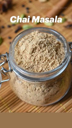 a glass jar filled with food sitting on top of a wooden table