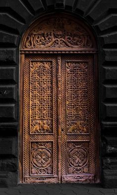 an old wooden door with intricate carvings on it