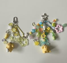 two charms with animals on them sitting next to each other