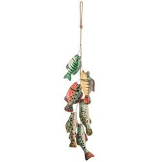 an ornament with fish hanging from it's side on a string,