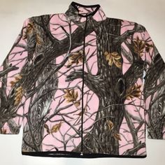 a pink camo jacket with trees on it and leaves hanging from the tree branches