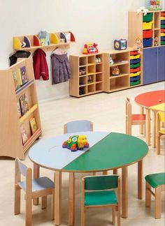 a child's playroom with toys and bookshelves