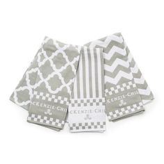 four gray and white kitchen towels on top of each other