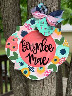 a wreath with the words boyfriende me hanging on a tree