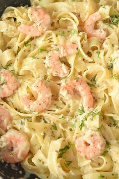 shrimp alfredo pasta in a pan with text overlay