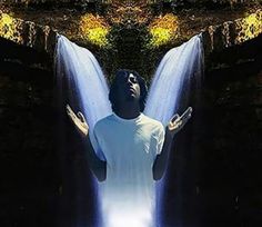 a man standing in front of a waterfall with his hands out to the side, surrounded by water