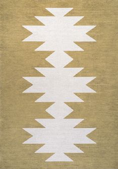 a beige and white rug with an arrow pattern