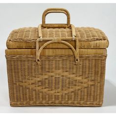 a large wicker basket with handle on top