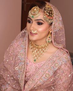 a woman in a pink bridal outfit