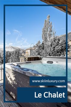 a large hot tub sitting on top of a wooden deck