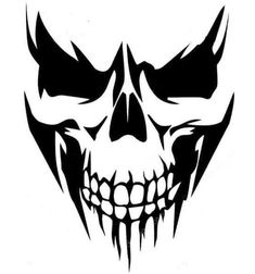 a black and white image of a skull with fangs on it's face,