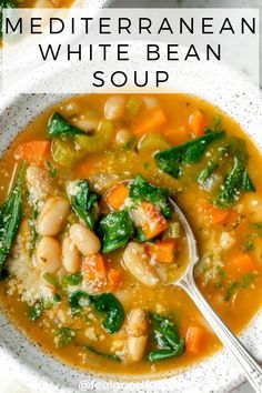 a bowl of white bean soup with spinach and carrots