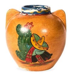 an orange vase with a cactus painted on it