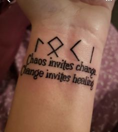 a person with a tattoo on their wrist that says chaos divides change, change inities healing