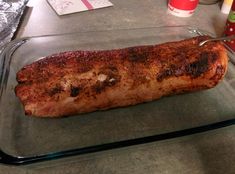 a piece of meat sitting on top of a glass tray