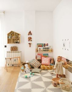 a child's playroom with toys on the floor