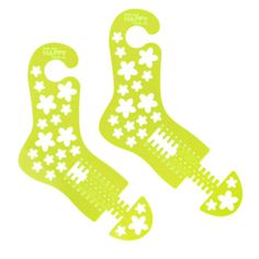 two green socks with white flowers on them