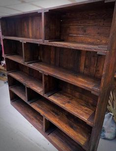 an old wooden bookcase with many shelves