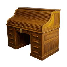 an old wooden desk with drawers on it