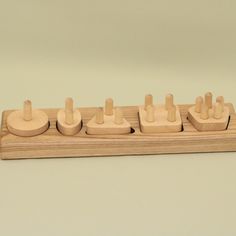 a wooden board game with pieces arranged on it