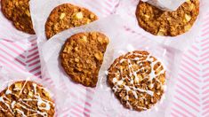 several cookies with white icing on top of them