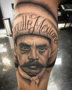 a man's leg with a tattoo on it