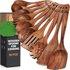 wooden spoons and spatulas are on display in front of a box with the package