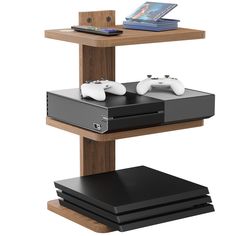 two video game controllers sitting on top of a wooden shelf