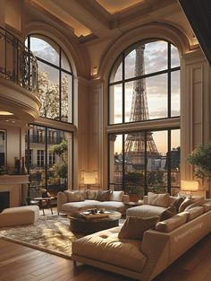 a living room with large windows overlooking the eiffel tower