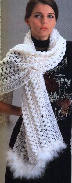 a woman wearing a white knitted scarf