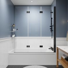 a bathroom with blue walls and white fixtures