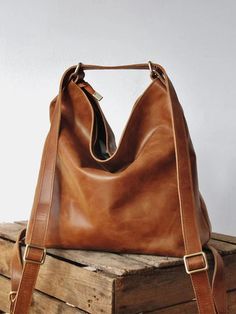 This bag made with a vintage-look, upholstery-weight distressed pu leather which ages beautifully. Wonderfully versatile: can be worn 3 ways - shoulder length, crossbody or handsfree as a backpack. Square Backpack, Women Backpack Travel, Large Leather Tote Bag, Vintage Backpacks, Women Leather Backpack, Large Leather Tote, Convertible Backpack, Leather Bag Women, Leather Hobo Bag