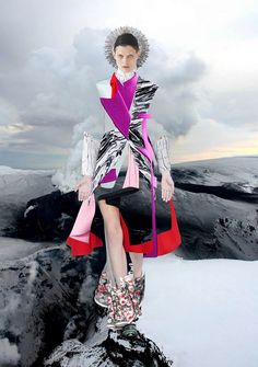 a woman in a dress and boots standing on top of a snow covered mountain with the words fresito artillo