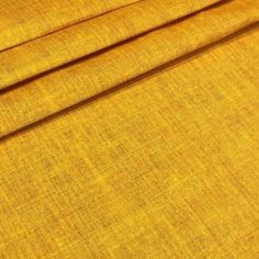 a close up view of yellow fabric