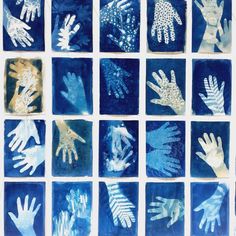 blue and white tiles with hand prints on them