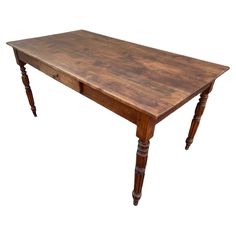 an old wooden table with two legs and a drawer on the top is isolated against a white background