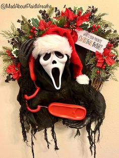 a fake ghost with a santa hat and mouth open