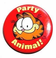 a red button that says party animal with a cartoon cat on it's face