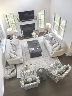 an overhead view of a living room with couches and chairs