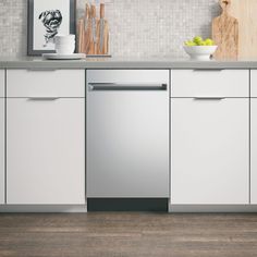 a dishwasher in a kitchen with white cabinets