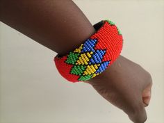 African Maasai bracelets, Zulu bracelets, Beaded bangles, Wrist bracelet, Leather bracelet, Tribal bracelet, Boho bracelets, Women bracelets These superbly crafted Zulu beaded bracelets are made of fine beads which can be worn in any occasion. The bracelets are well beaded and can match any outfit. Primary Color: Red. Secondary Color: yellow, green & blue Can be customized in different colors. **Bracelet size is 7.5 inches for a normal wrist. If you have a larger wrist kindly let me know**    Th Multicolor Beaded Bangle As Gift, Zulu Bracelets, Beaded Bangles, Women Bracelets, Bracelets Women, Wrist Bracelet, Bracelets Beaded, Bead Bangles, Bracelet Leather