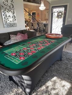 a casino table in the middle of a living room