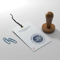 a rubber stamp on top of a piece of paper next to a pair of scissors