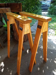 two wooden benches sitting next to each other