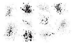 black ink splattered on white paper with different shapes and sizes, including dots