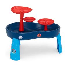 a blue and red toy water table with two cups on it's legs, in front of a white background