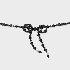 Black choker necklace from Wild Fable™ designed with glass beads. Features a bow at the center for an amazing look. Lobster claw clasp closure and an extender chain offer a secure fit around the neck. If you're not satisfied with any Target Owned Brand item, return it within one year with a receipt for an exchange or a refund. Wild Fable™: A look for every story. Necklaces Choker Black, Black Choker Gold Necklace, Black Necklace With Pearl, Luxury Black Choker Necklace, Black Jewelry Necklaces, Xo The Weeknd Necklace, Choker Bead Necklace, Dr Teeth, Silver Wire Jewelry