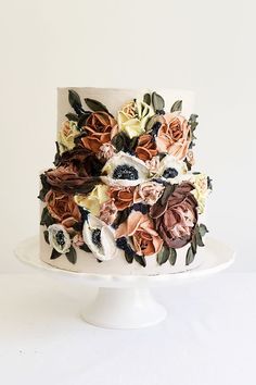 a white cake topped with lots of flowers